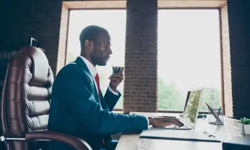 An improper lane changes lawyer in a red brick office working on his client's claim.