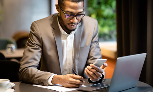 A Hartford lawyer at an office desk working on a car accident liability case for a client.