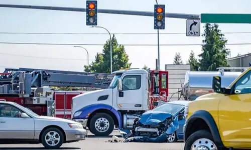 An accident at an intersection blocking traffic from passing through.