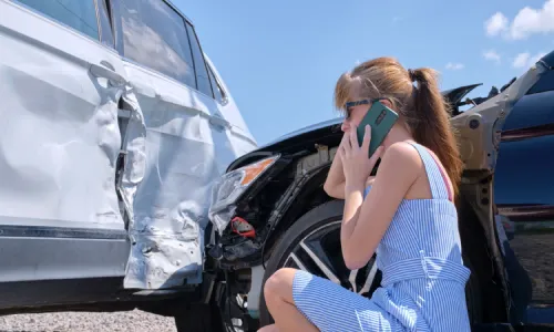 A woman calling for legal help after a rideshare vehicle crashed into the side of her car.